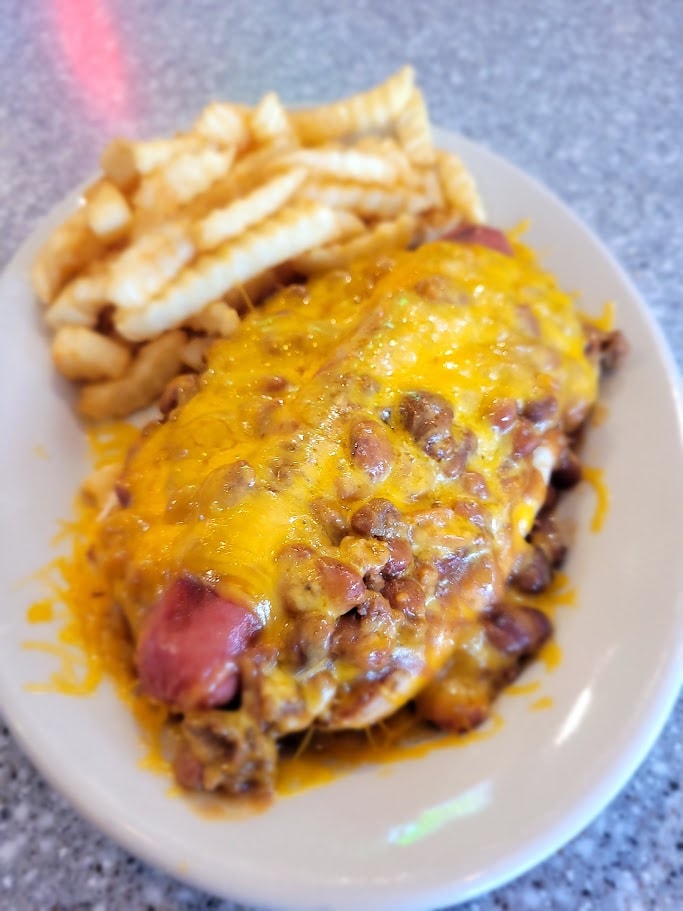 Cheeseburger with melted cheese and fries