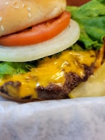 Cheeseburger with tomato and lettuce