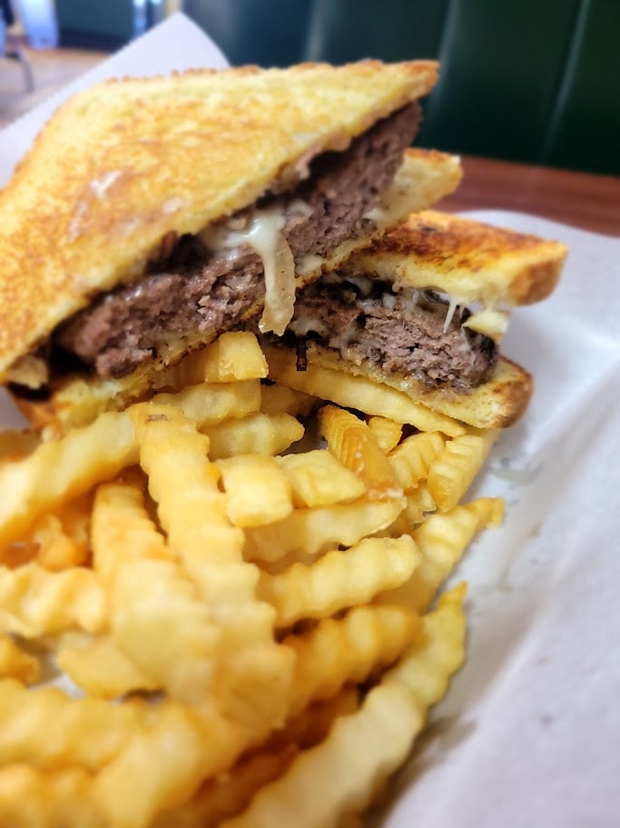 Arepa sandwich with beef and fries