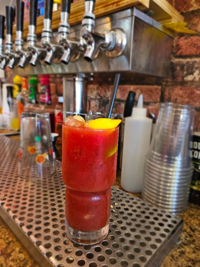 Red cocktail at the bar