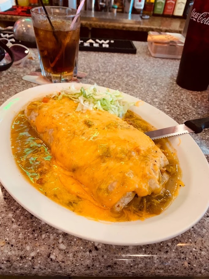 Chile relleno with cheese sauce and coleslaw